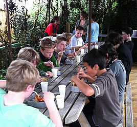 children enjoying a meal after a laser game party